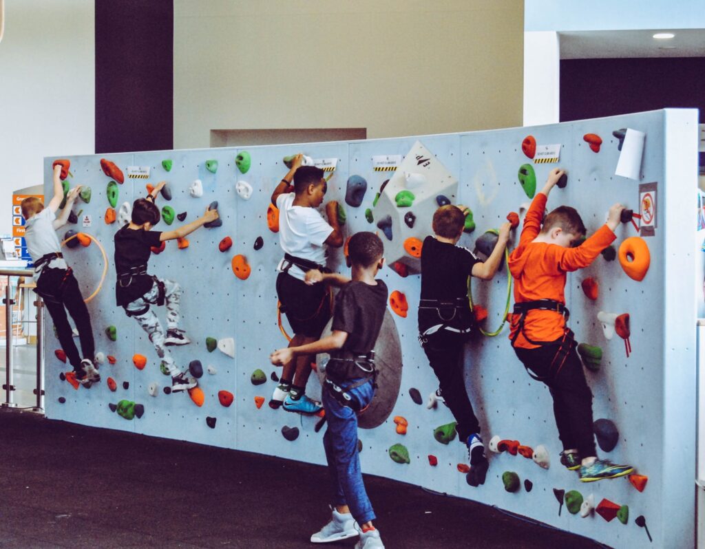 Children climbing on a climbing wall